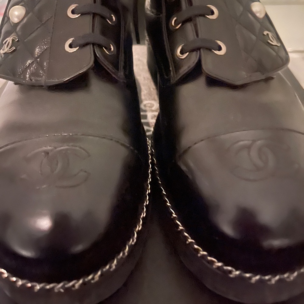 CHANEL black combat boots size 41. Fits more like a women size 10.